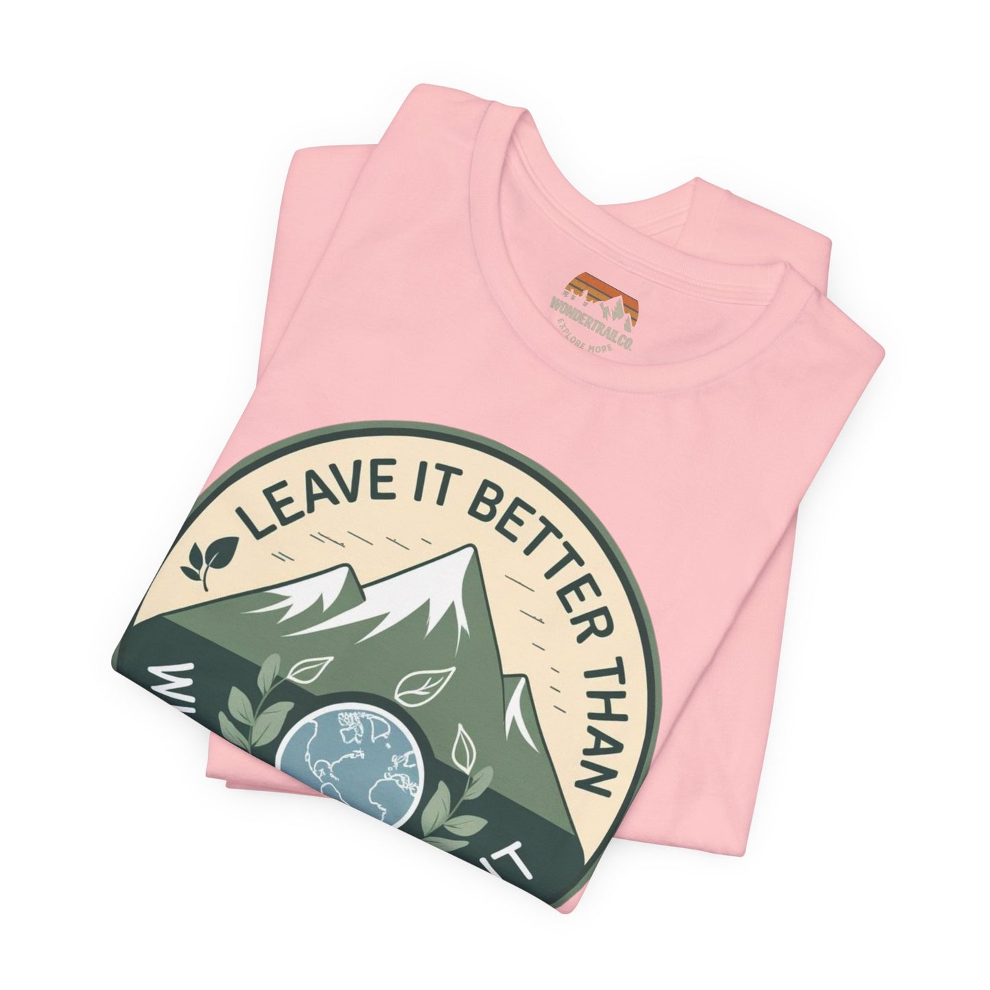 Pink t-shirt with a mountain graphic and 'Leave It Better Than You Found It' text on a white background