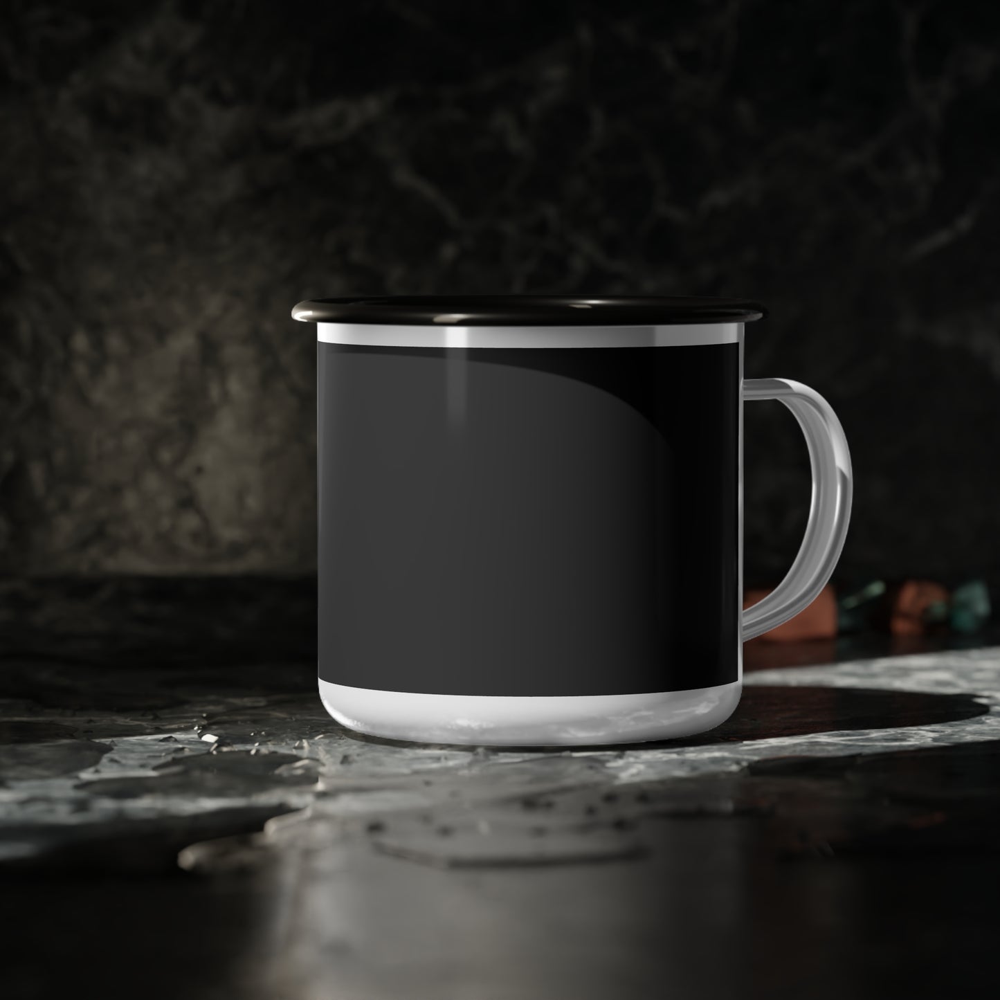 Black mug with white interior on a dark surface