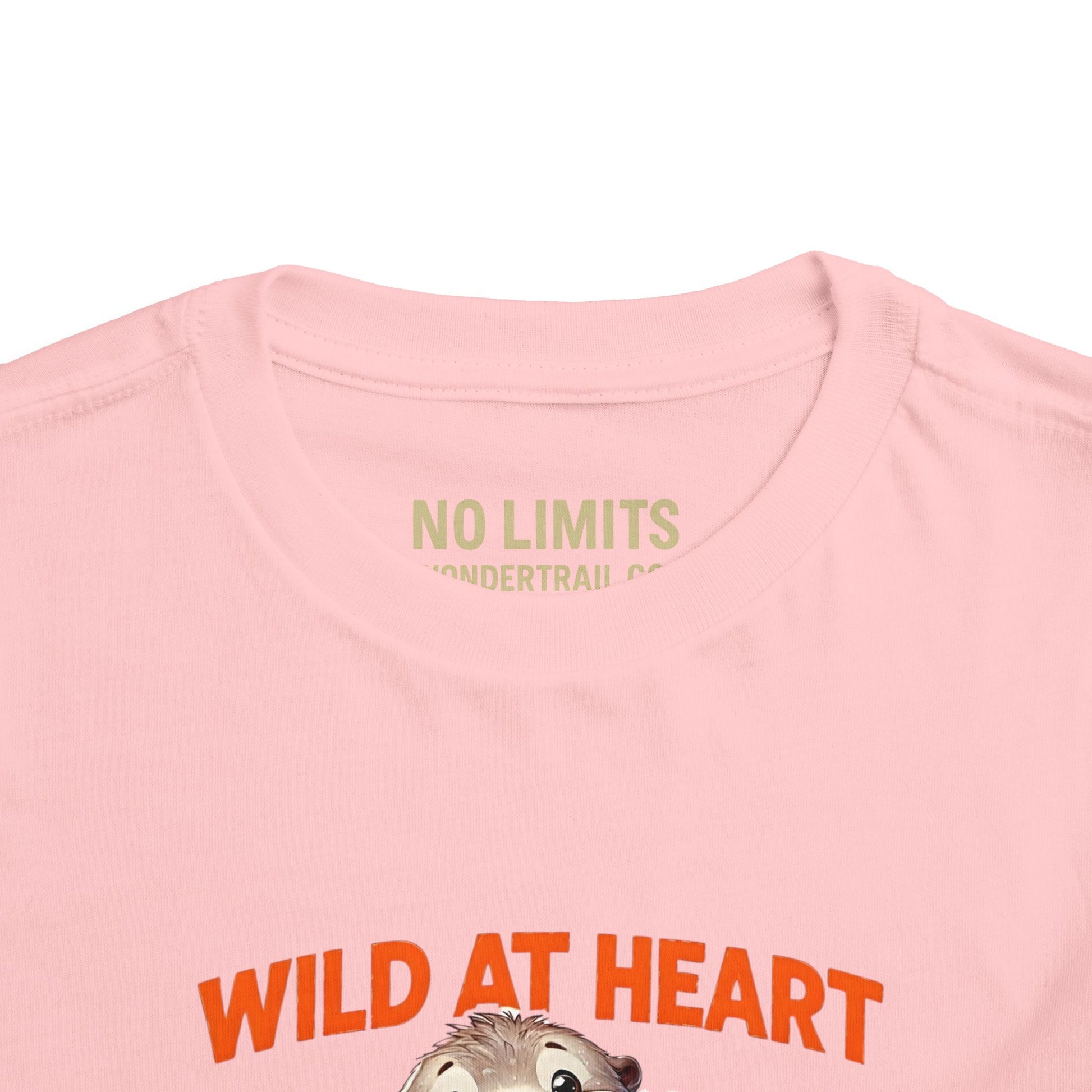 Pink t-shirt with 'Wild at Heart' text and graphic on a white background