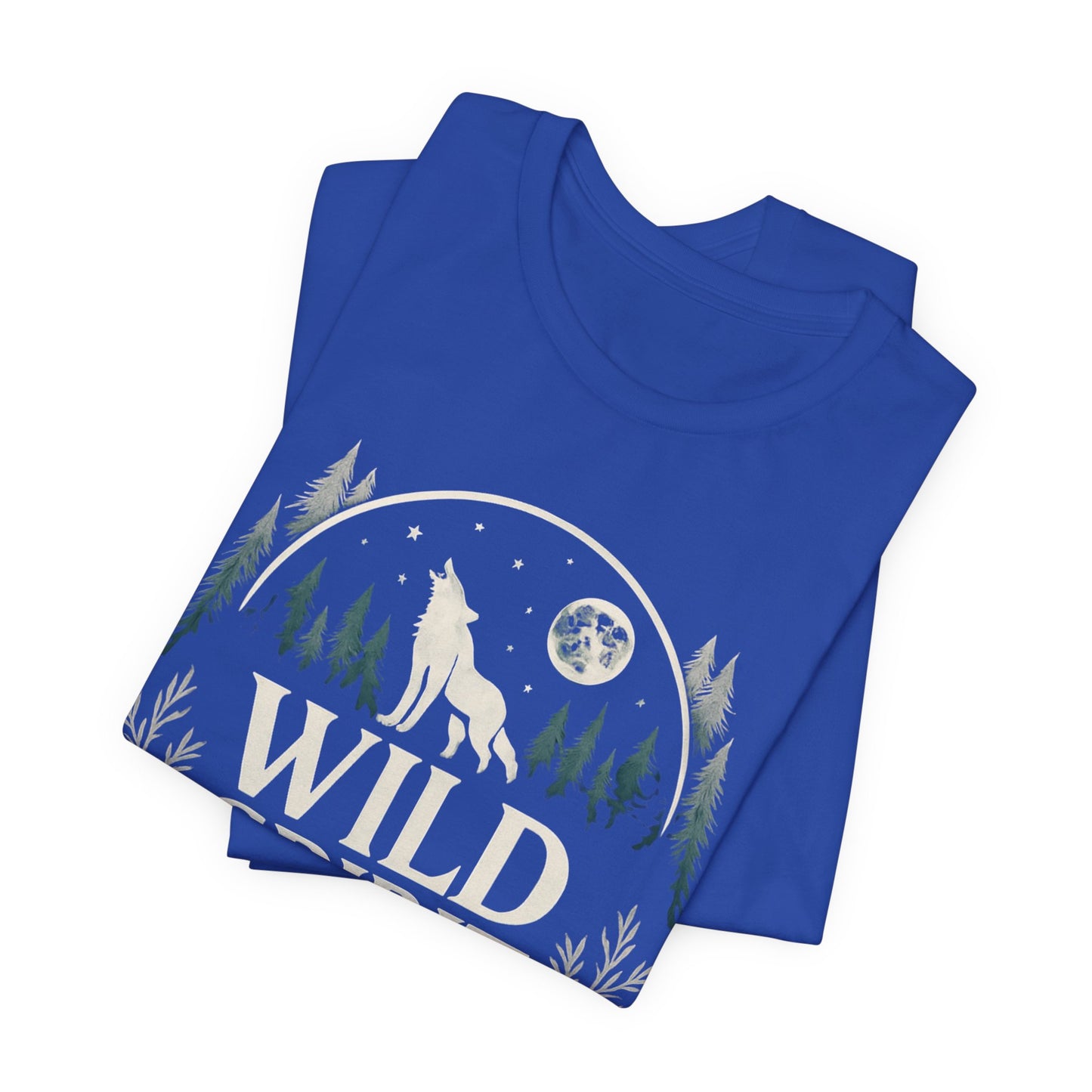 Folded blue t-shirt with a wolf and forest design on a white background