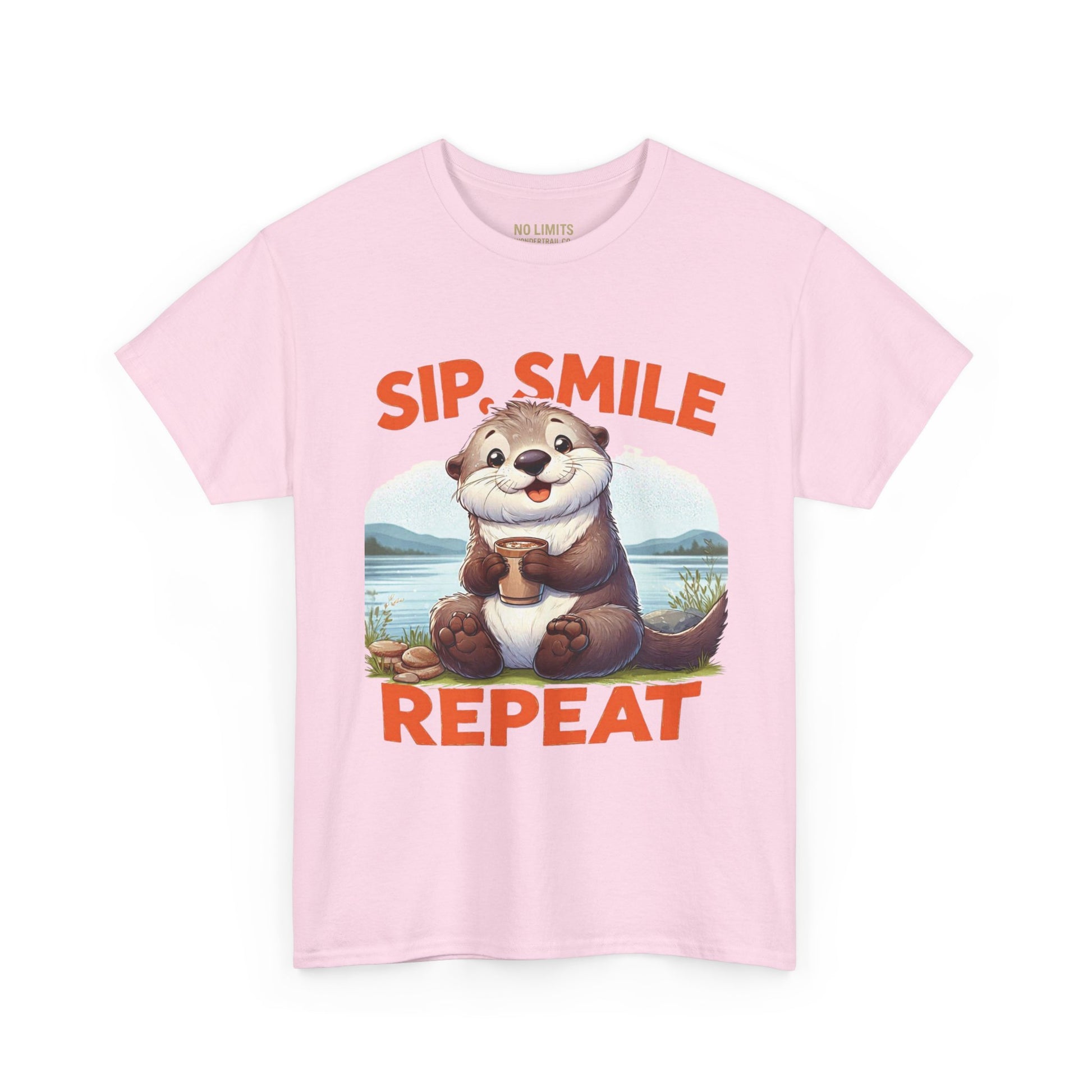 Pink t-shirt with an otter graphic and text 'Sip. Smile. Repeat.' on a white background