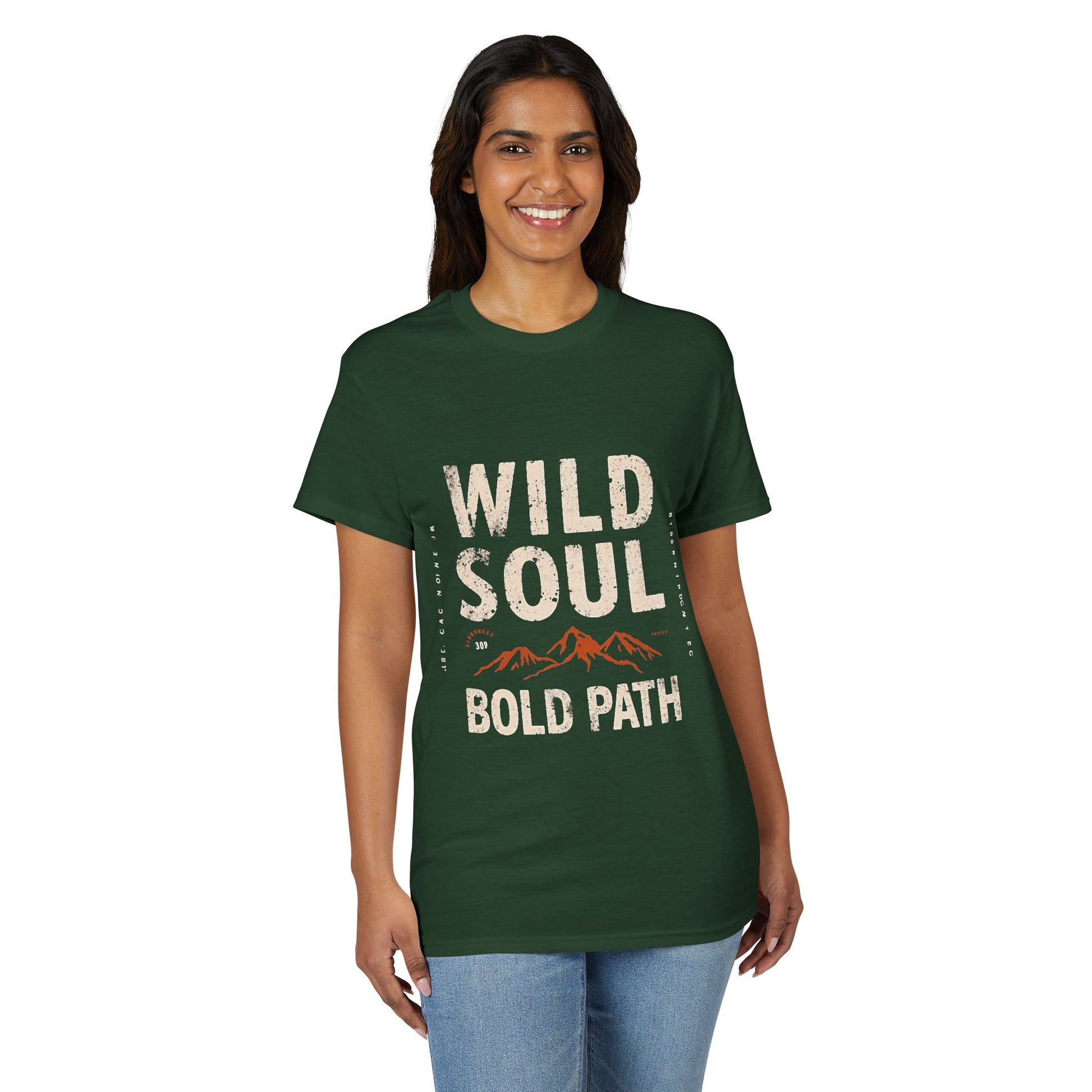 Woman wearing a green t-shirt with 'Wild Soul Bold Path' text and mountain graphic on a white background