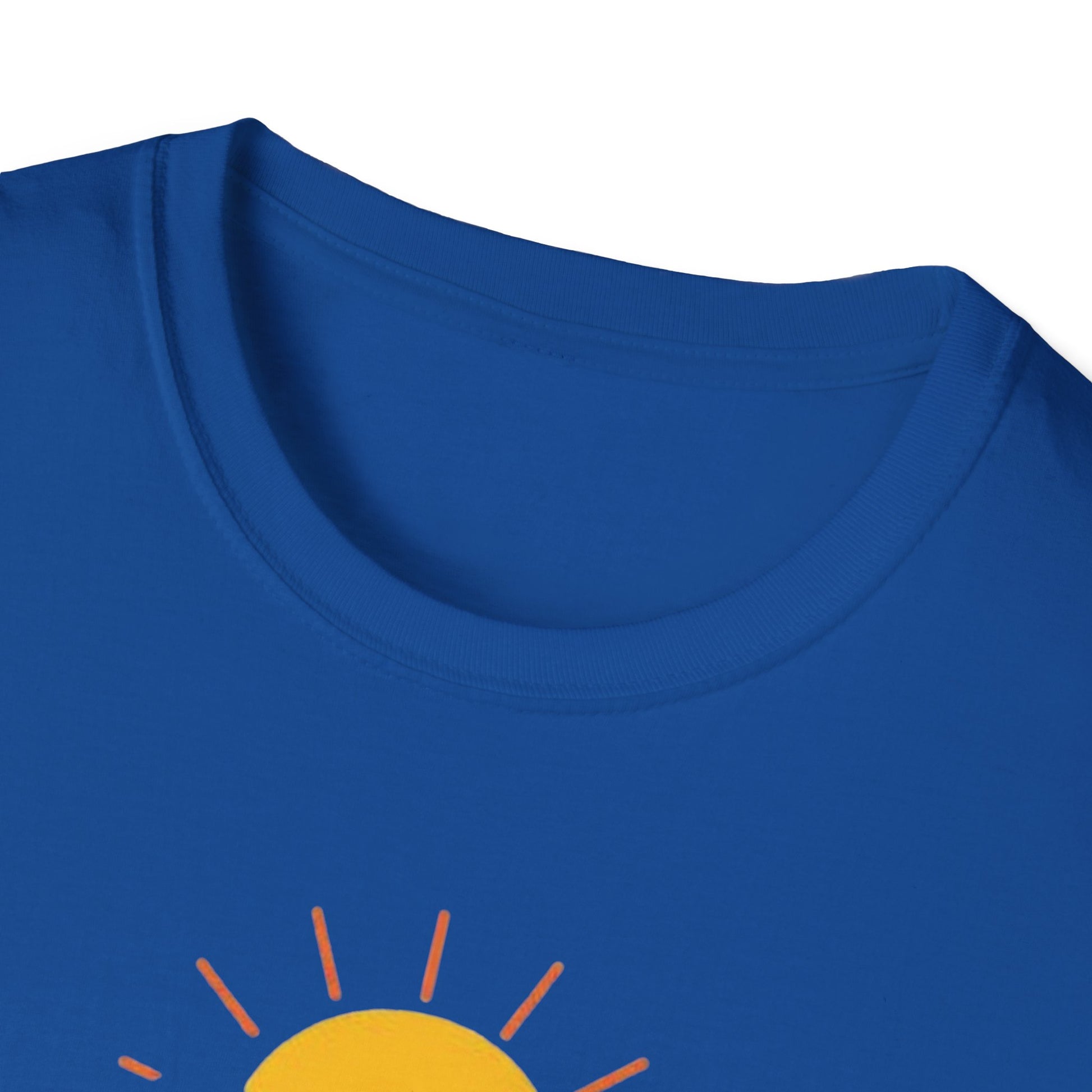 Close-up of a blue shirt with a yellow sun graphic on a white background
