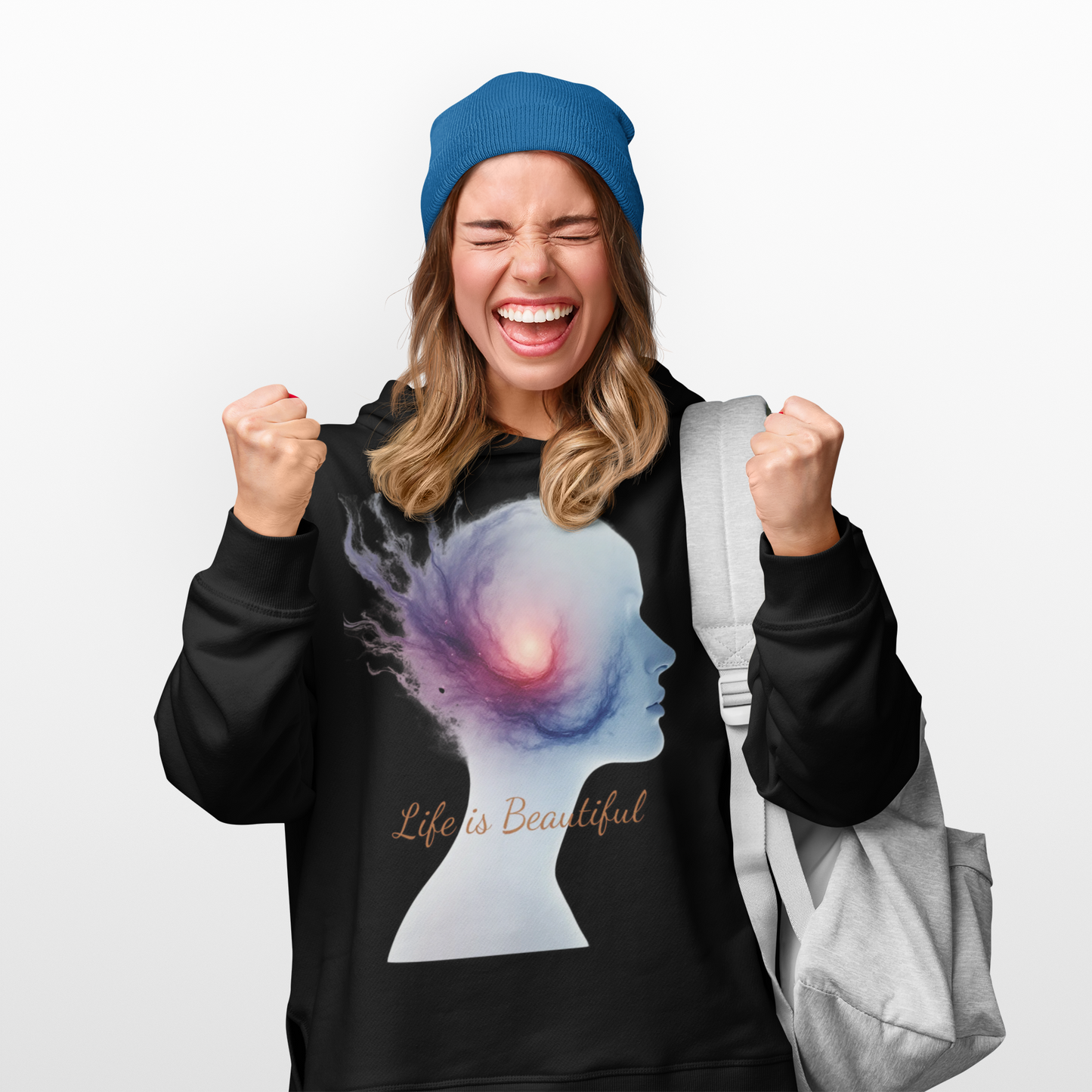 Person wearing a black hoodie with a colorful design and 'Life is Beautiful' text, holding a gray bag.