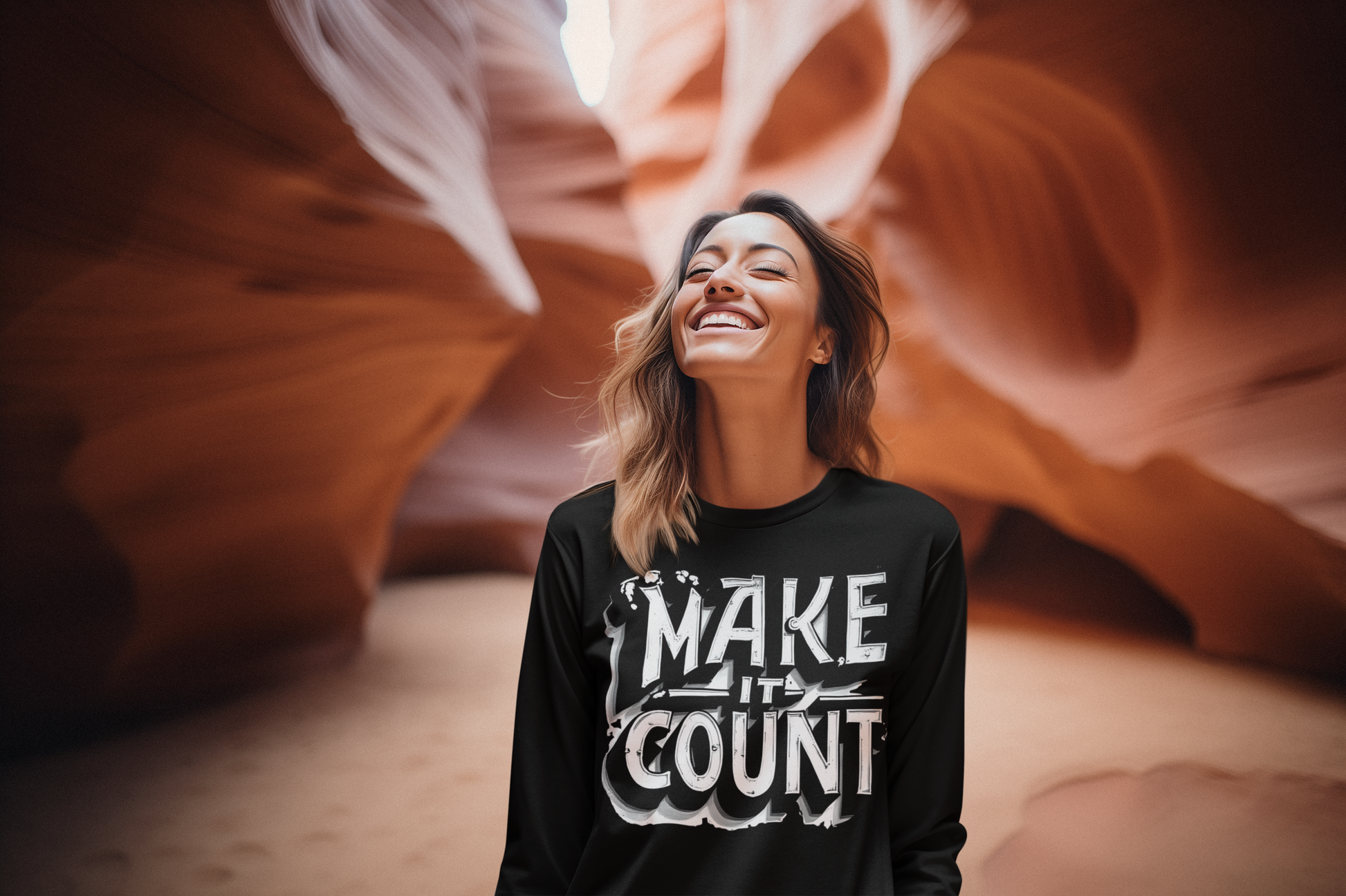 Woman wearing a black sweatshirt with 'MAKE IT COUNT' text in a desert canyon.