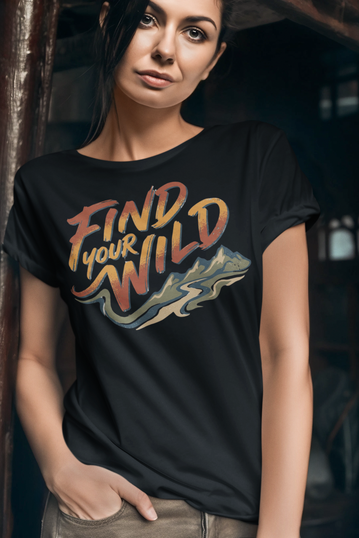 Woman wearing a black t-shirt with 'Find Your Wild' design.