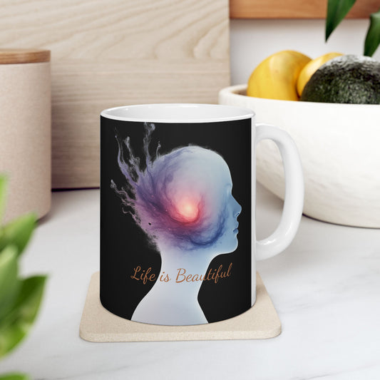 Mug with artistic design and 'Life is Beautiful' text on a coaster.