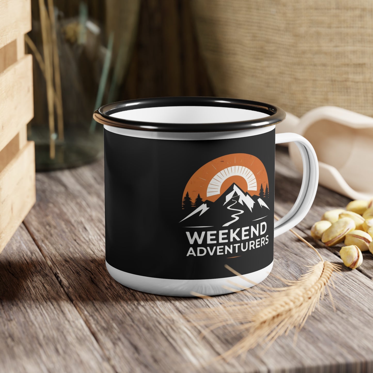 Black mug with 'Weekend Adventurers' design on a wooden surface