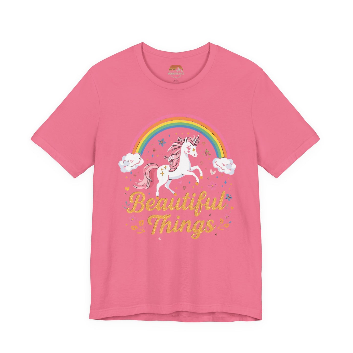 Pink t-shirt with a unicorn and rainbow graphic and 'Beautiful Things' text on a white background
