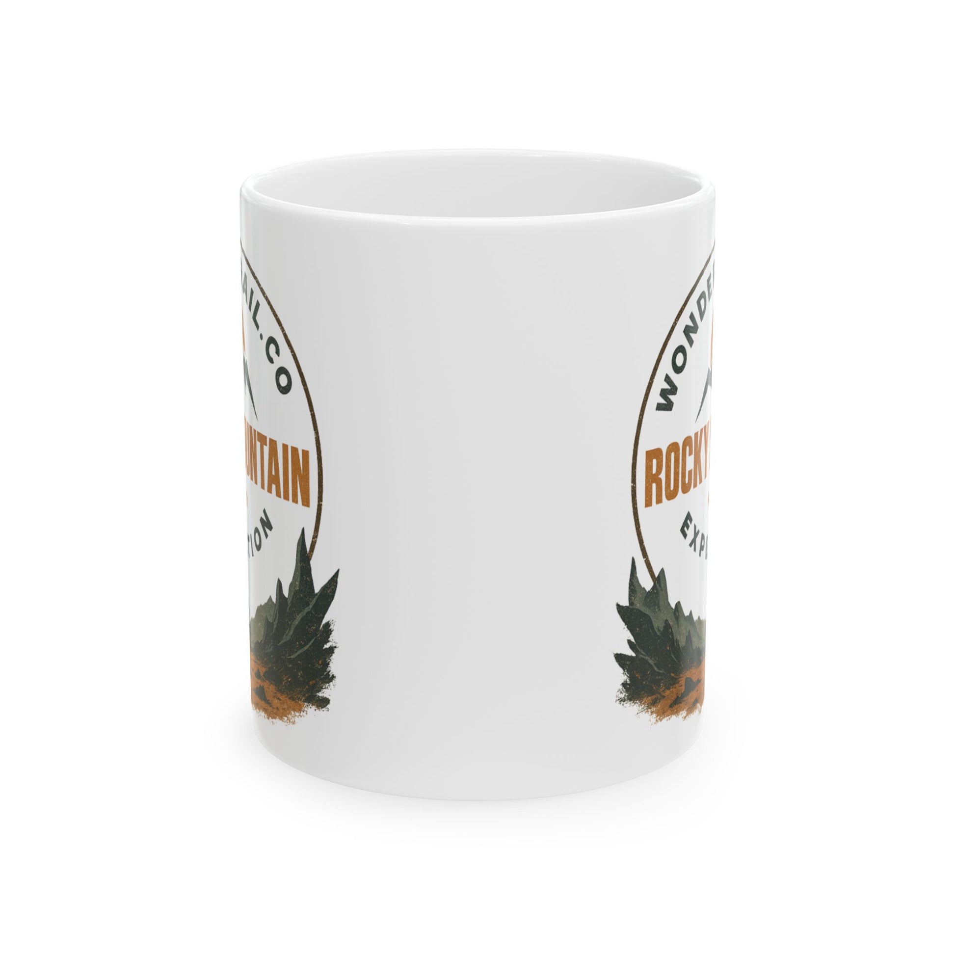 White mug with mountain and pine tree design on a white background
