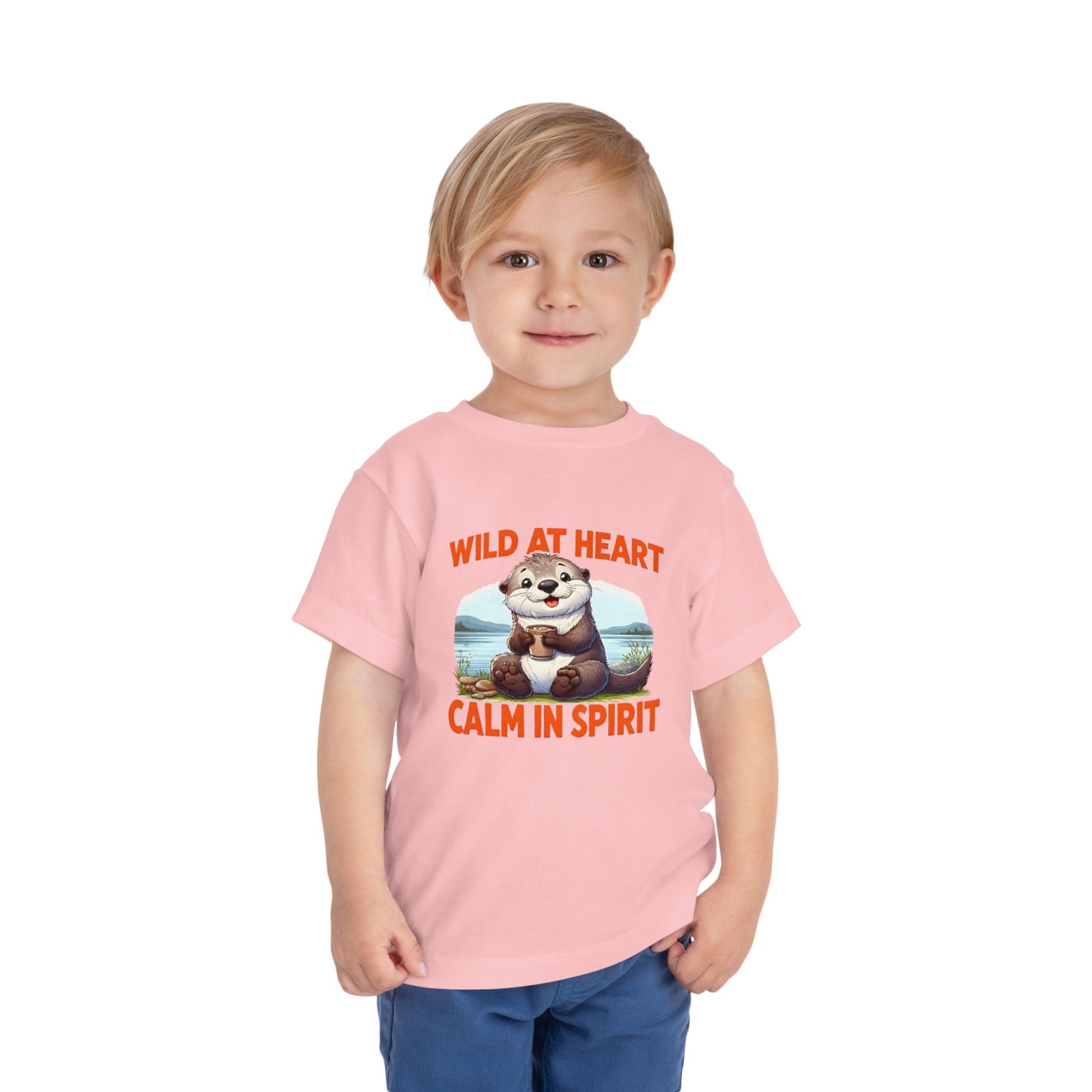 Child wearing a pink t-shirt with an otter graphic and text on a white background