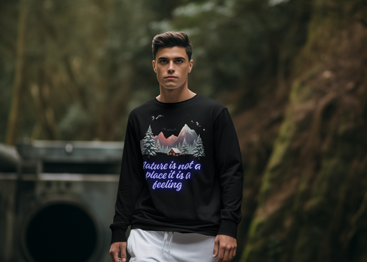 Black unisex sweatshirt with colorful cabin, pine trees, and mountain night sky graphic plus Nature is Not a Place It Is a Feeling slogan — WonderTrail.Co outdoor adventure apparel for hikers, campers, and nature lovers.