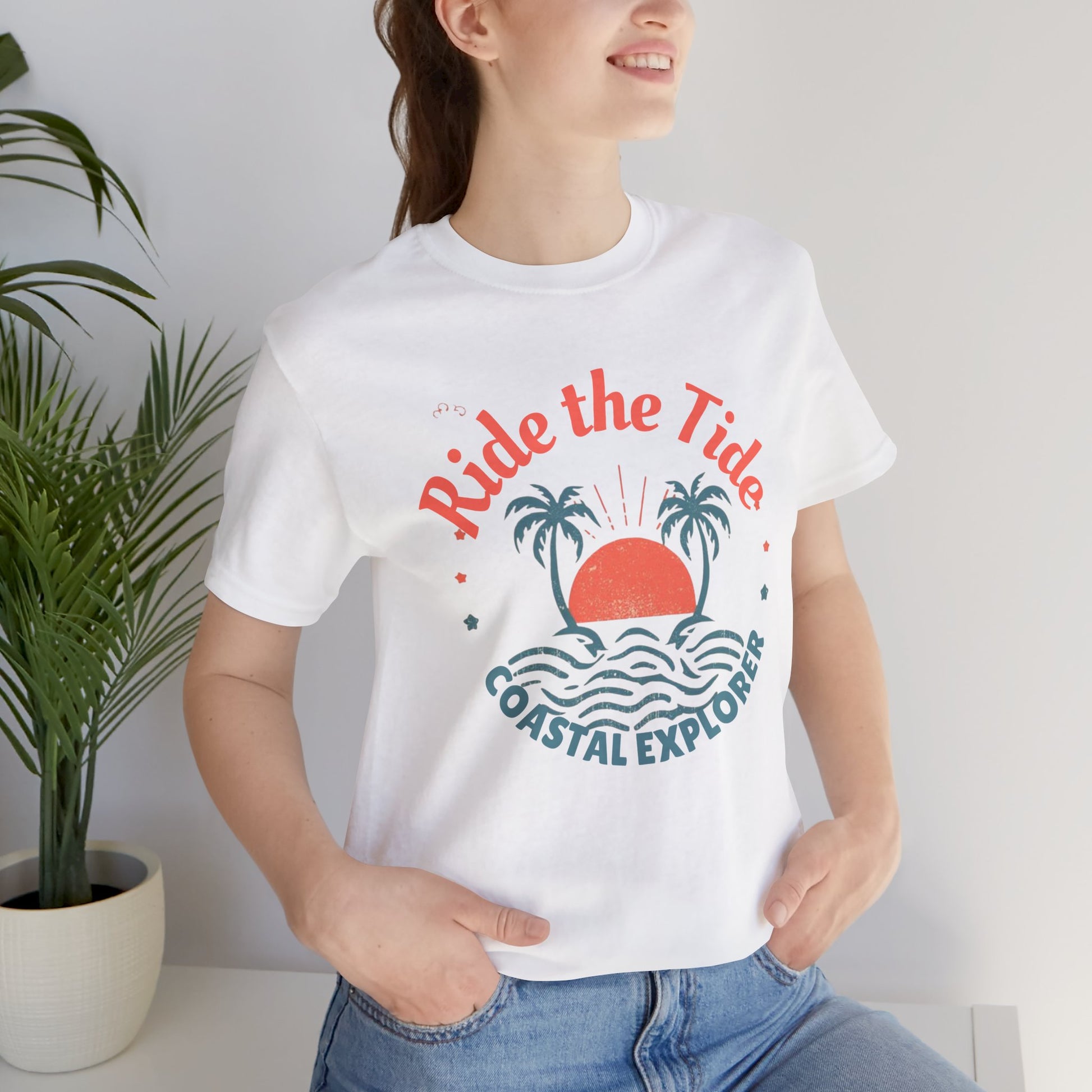 Front White Black_cotton_unisex_tee_featuring_tropical_sunset_and_palm_tree_design_with_Ride_the_Tide_Coastal_Explorer_text_stylish_travel_apparel_for_adventurers.