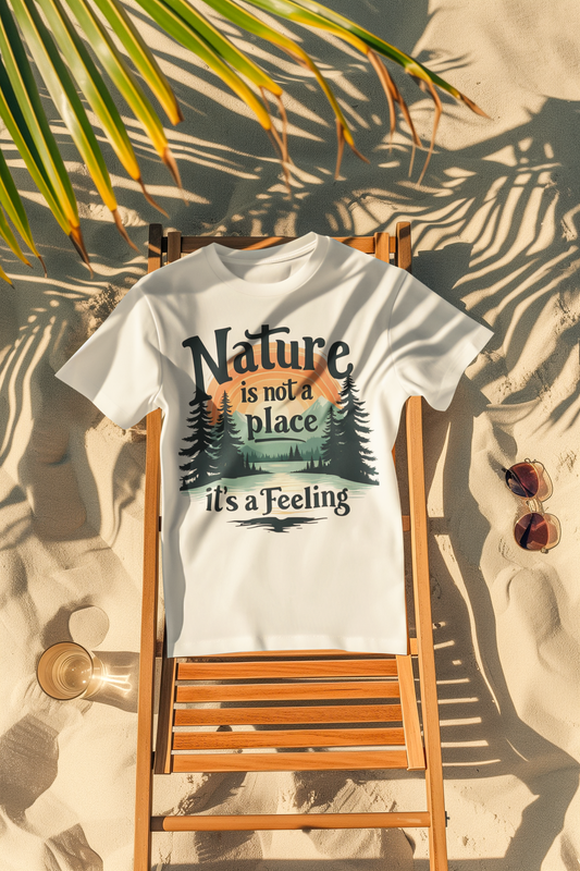 White unisex T-shirt with scenic mountain and tree design plus inspirational Nature Is Not a Place It’s a Feeling slogan — WonderTrail.Co outdoor lifestyle apparel for hikers, campers, and nature lovers.
