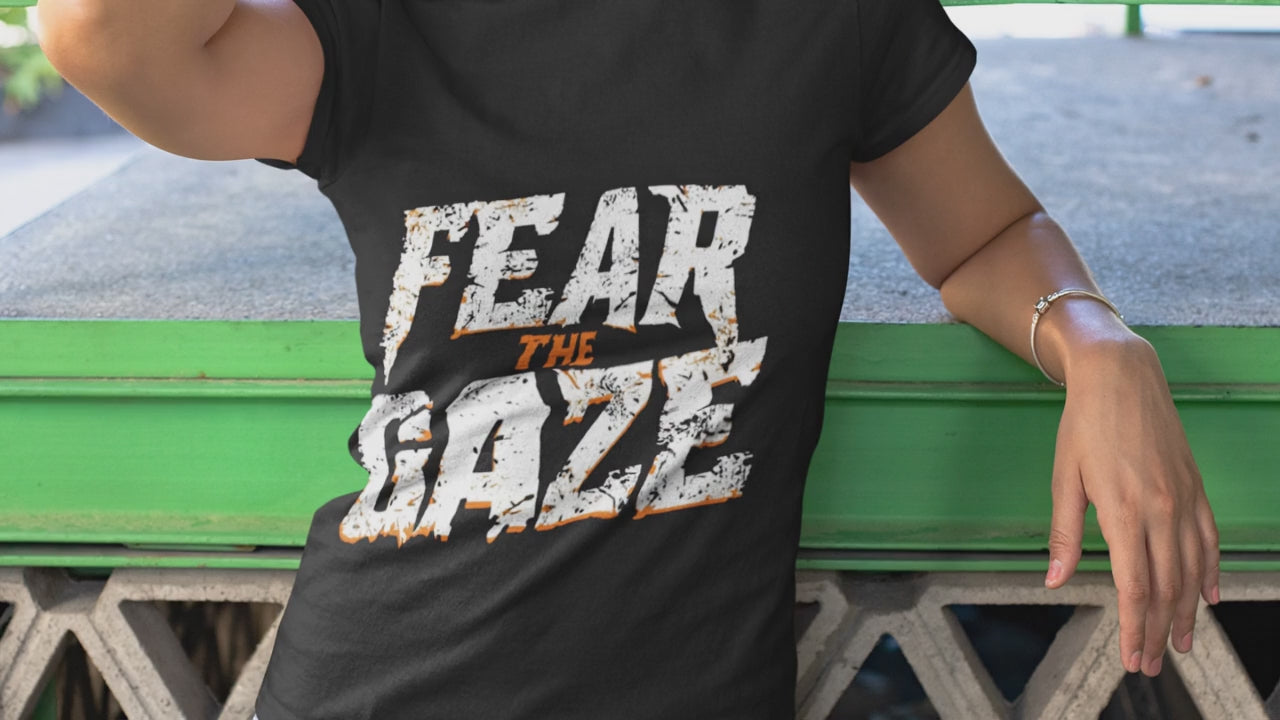 Firefly Create a cinematic short video featuring two models wearing black t-shirts with bold tiger-e